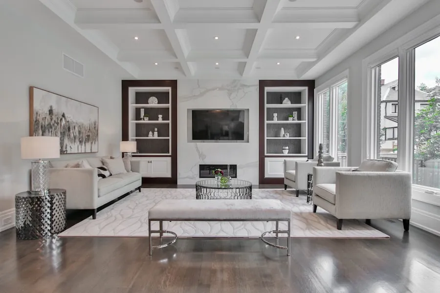 Bright Toronto living room with a coffered ceiling and tall bare windows onto the street